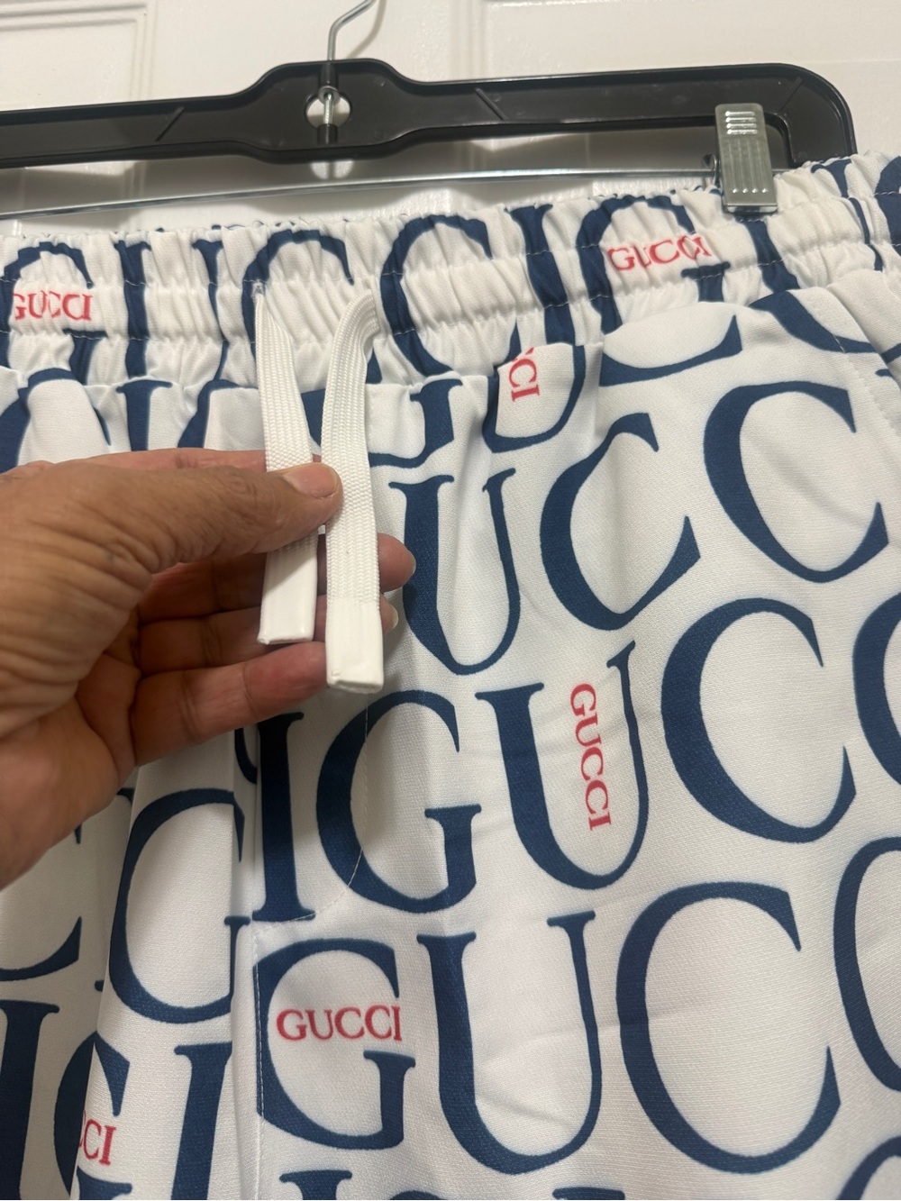 Beautiful shorts featuring a navy-and-red logo print with red accents. new - Picture 7 of 11